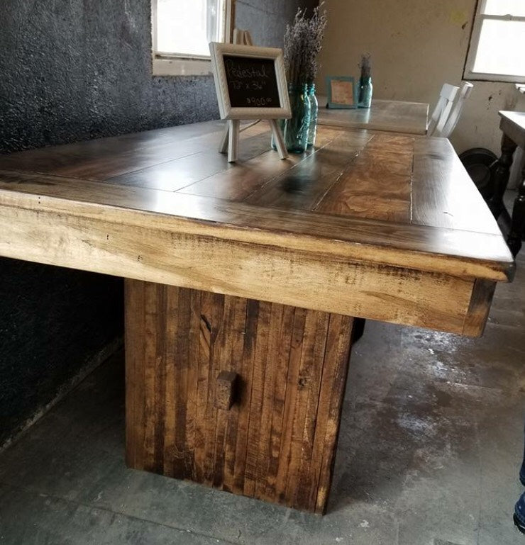 Farmhouse Pedestal Dining Table Crafted From Rough Cut Wood