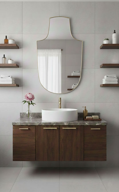 Arch-top shield brass mirror above modern bathroom vanity