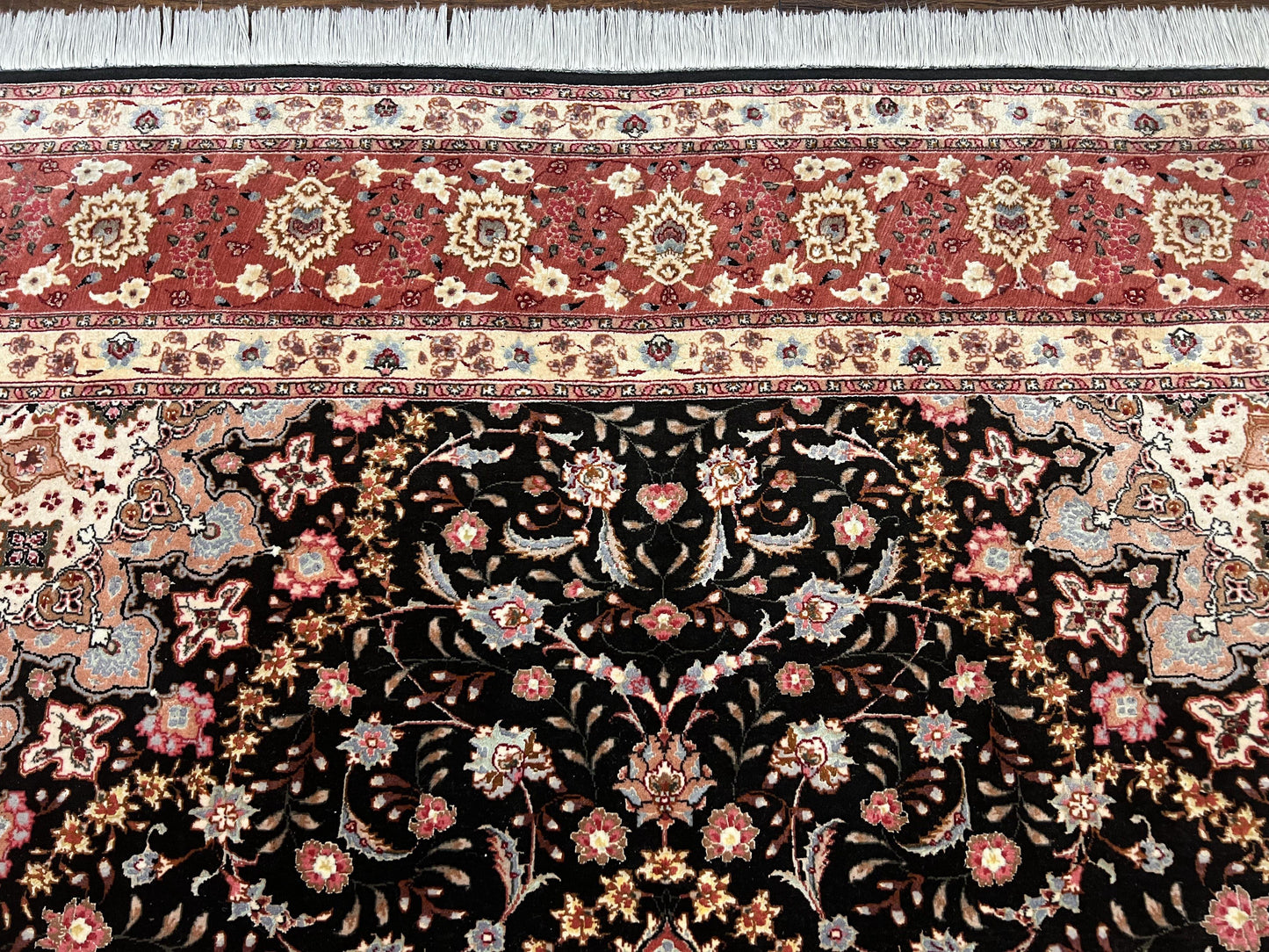 Black and rust Tabriz rug