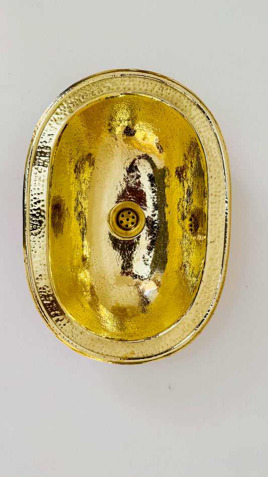 a gold plate with a circular design on it