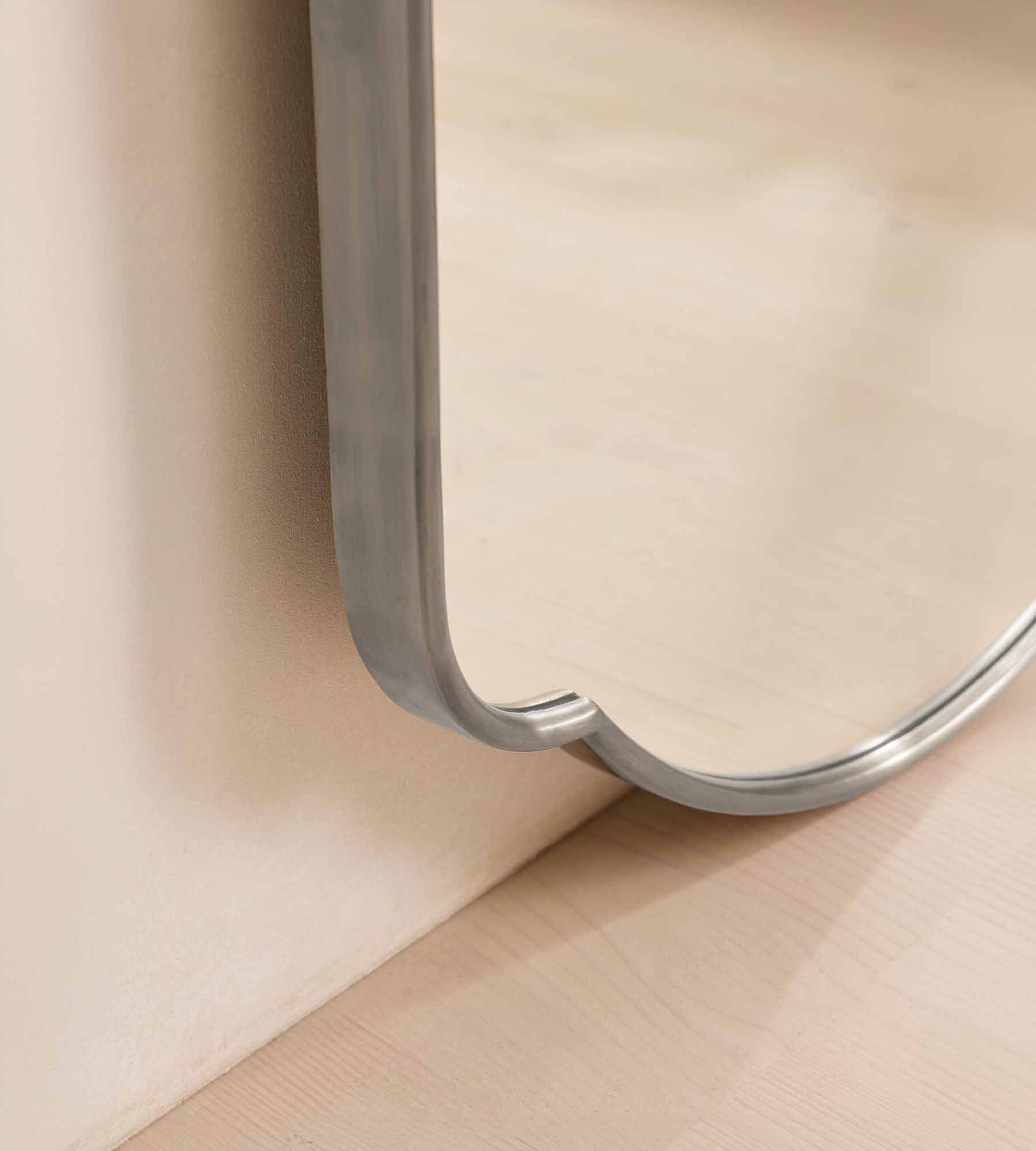 Oversized arched silver mirror