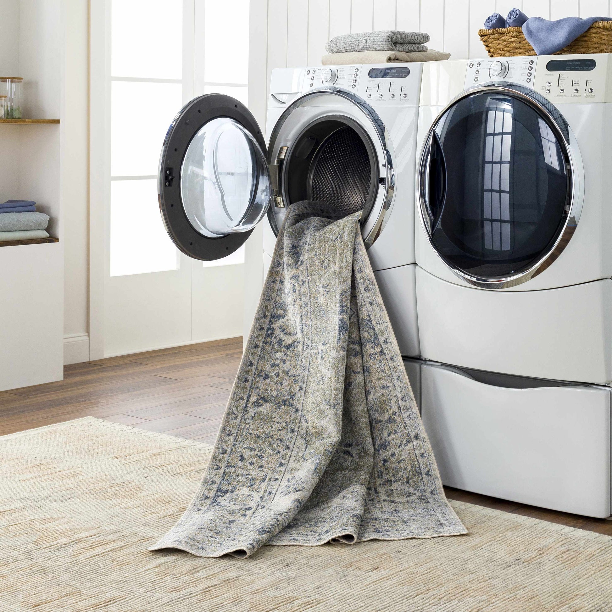 Laundry room with a dryer and towel draped over it