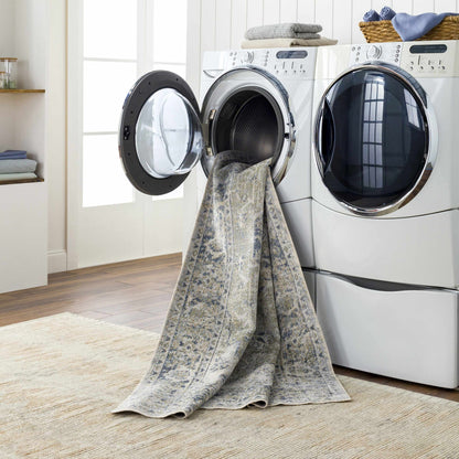 Laundry room with a dryer and towel draped over it