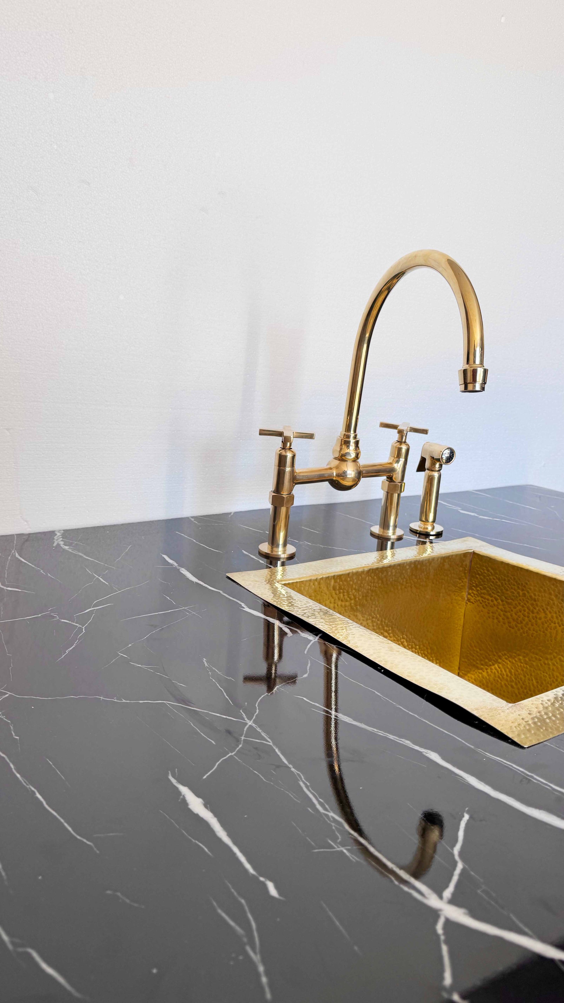 Unlacquered Brass Kitchen Faucet in the kitchen