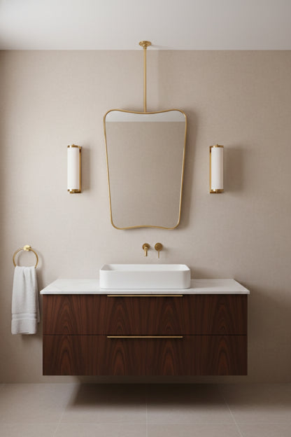 Modern bathroom with suspended brass butterfly mirror and wall sconces
