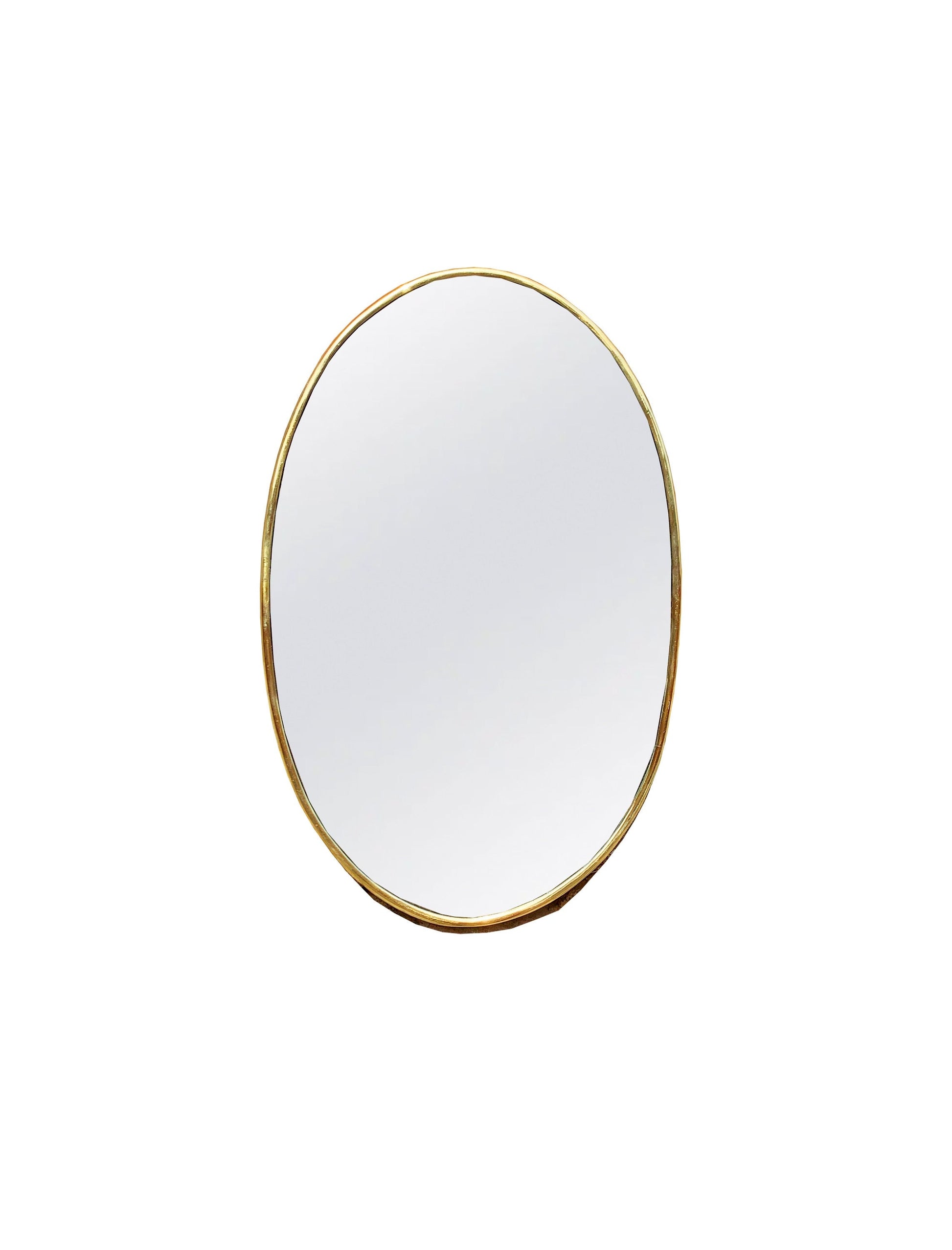 a round mirror with a gold rim on a white background