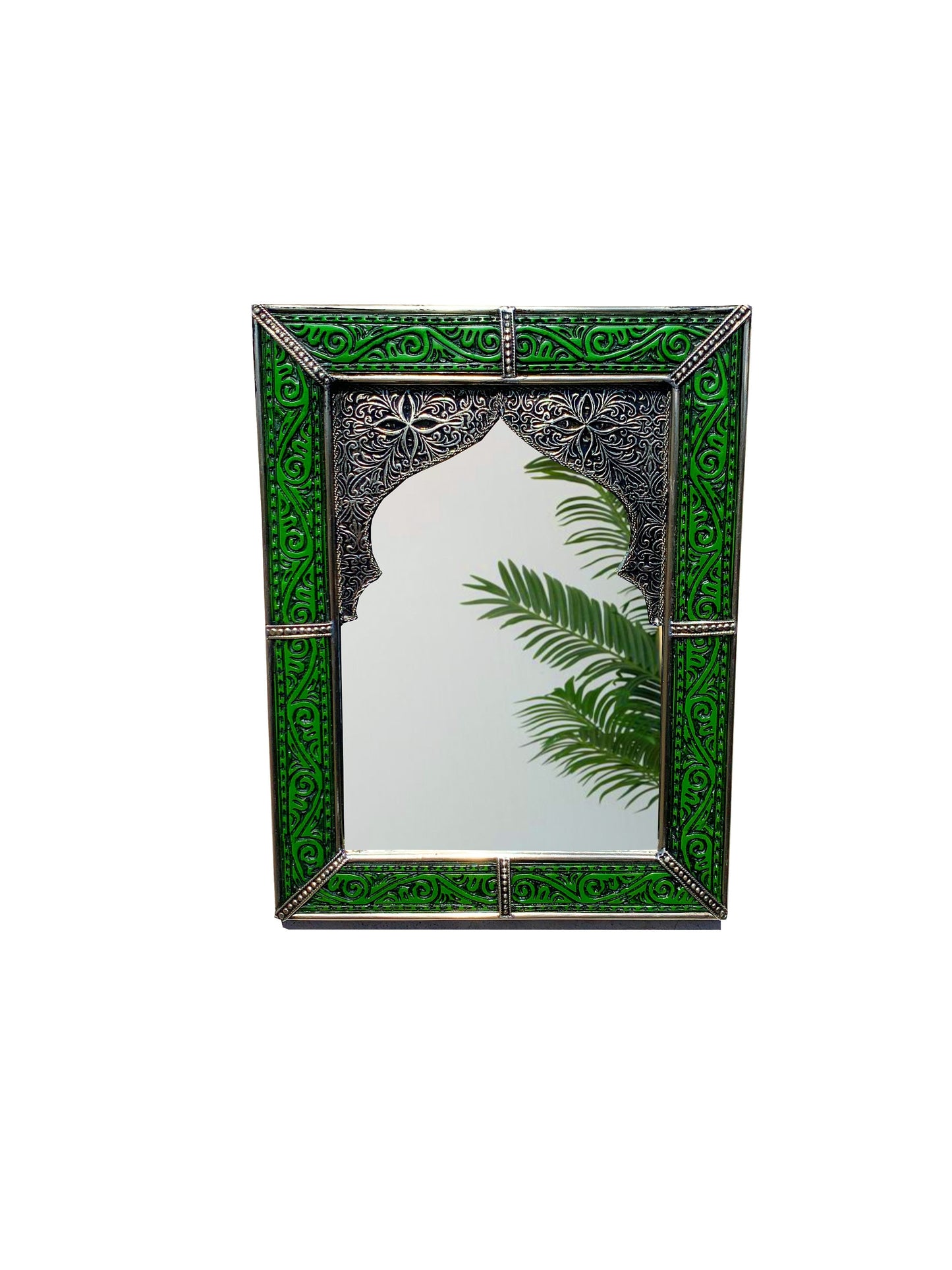 a mirror with a palm leaf on it