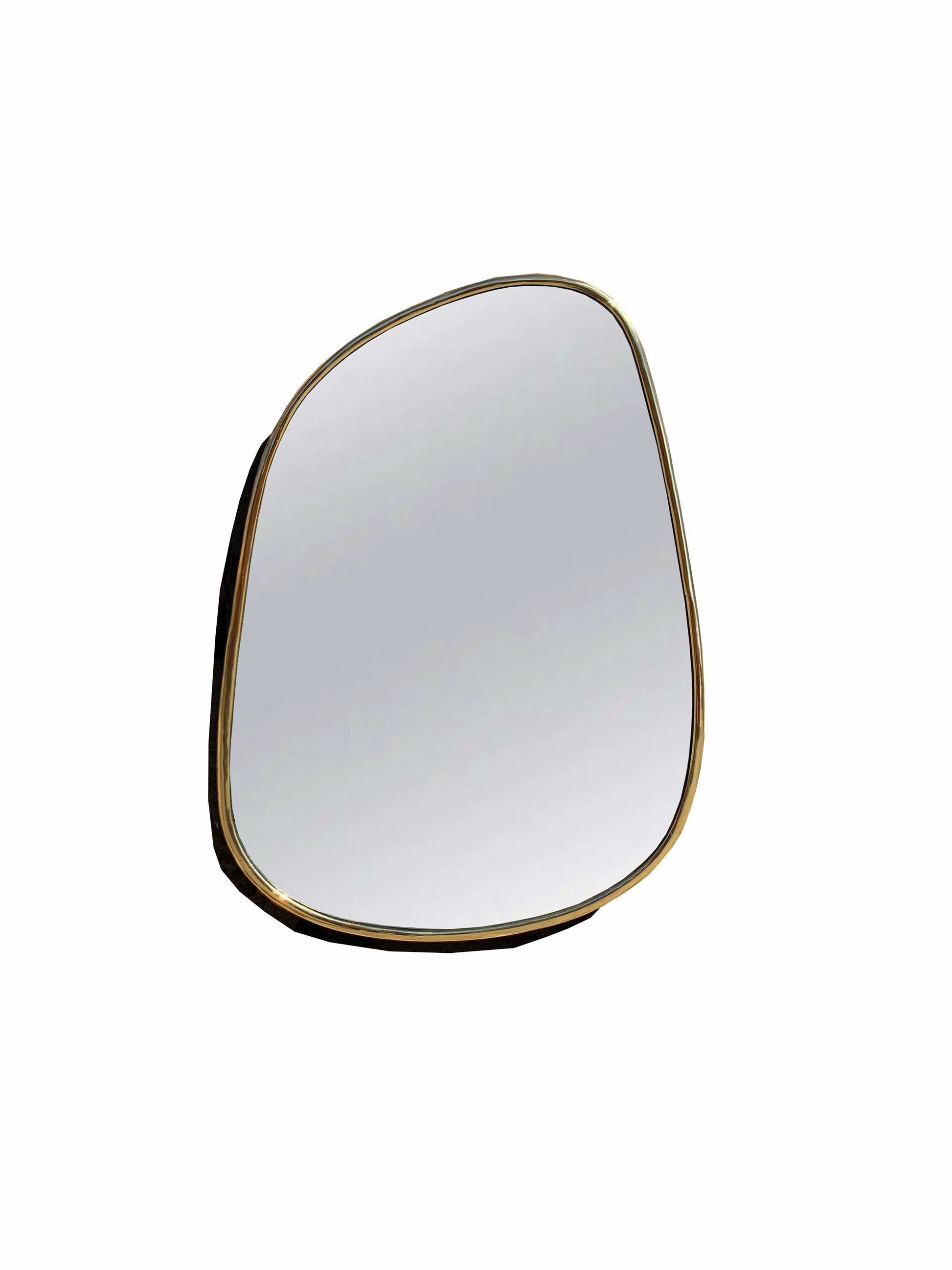 a close up of a mirror with a white background
