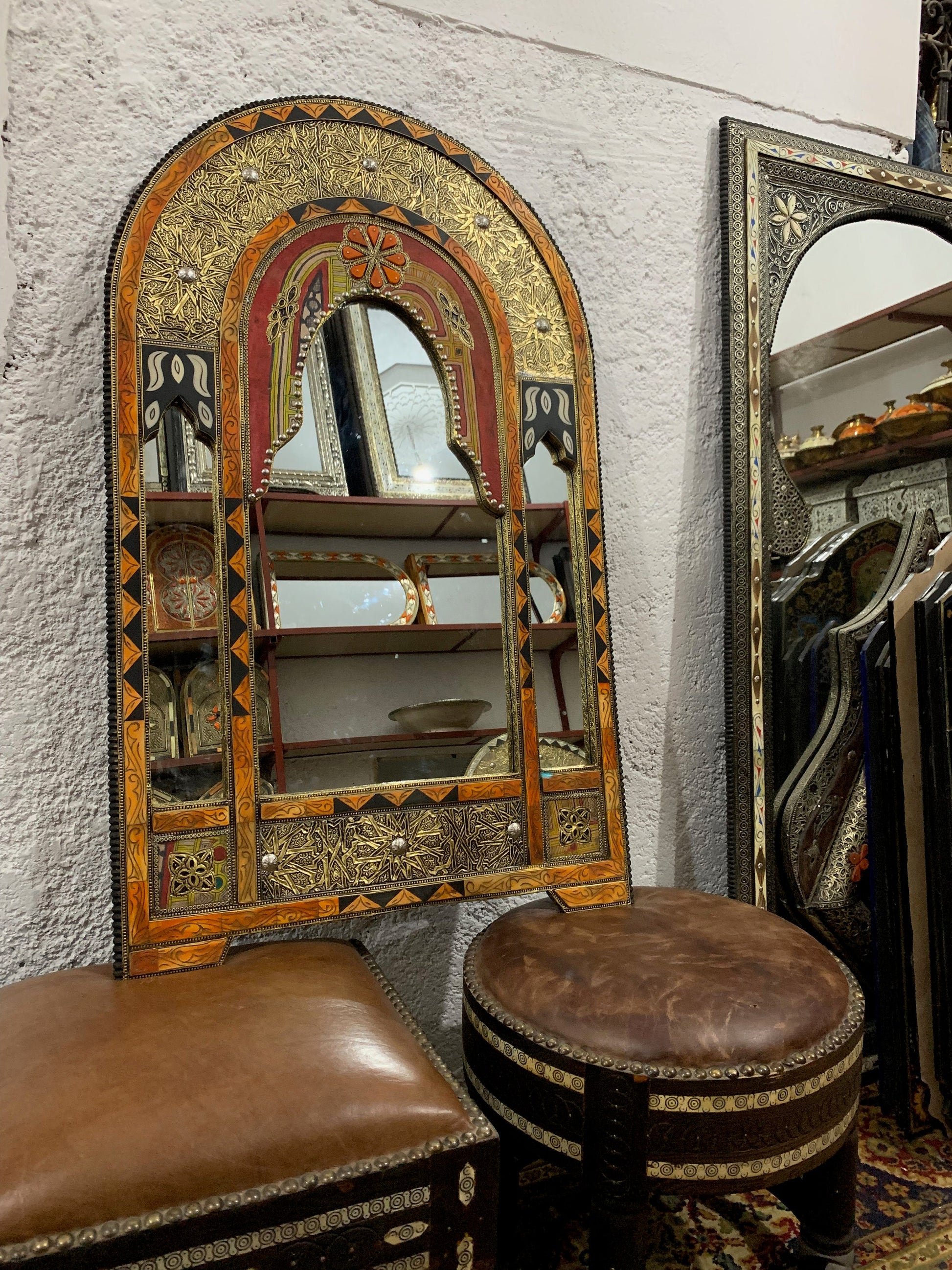 a mirror and stool in a room