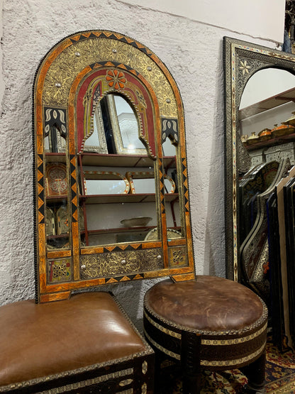a mirror and stool in a room