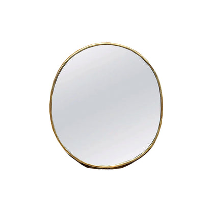 a round mirror on a white wall