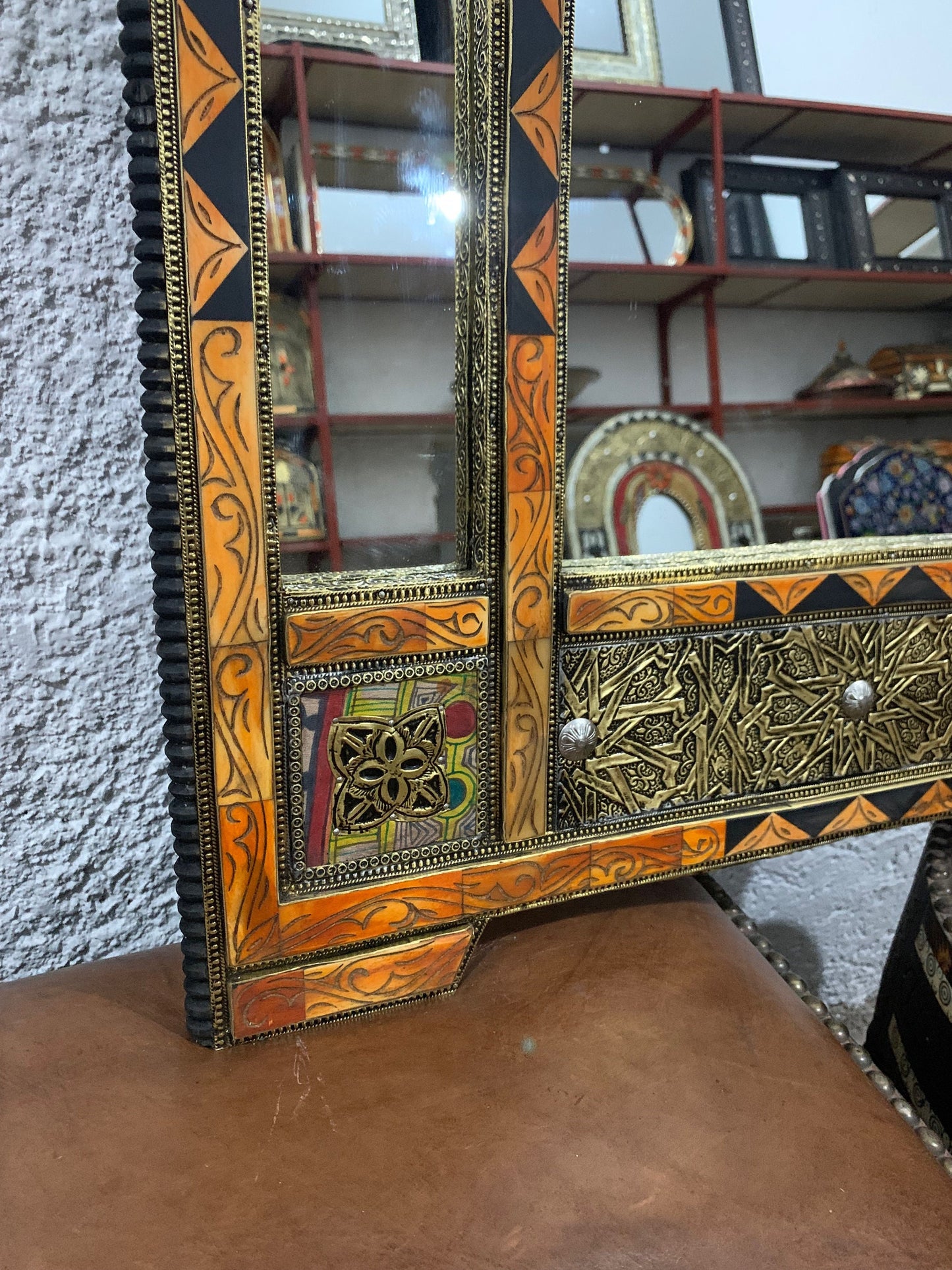 a wooden dresser with a mirror on top of it