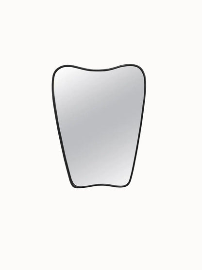 an apple shaped mirror on a white wall