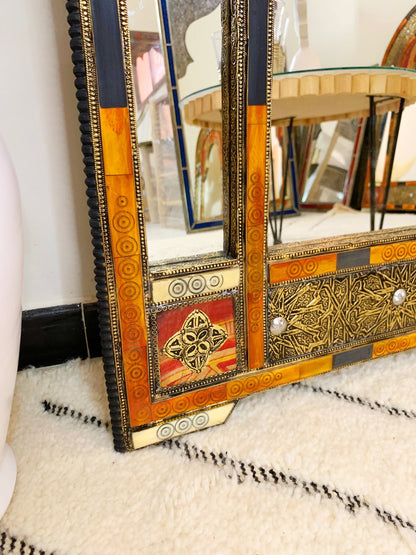 a mirror sitting on top of a white rug