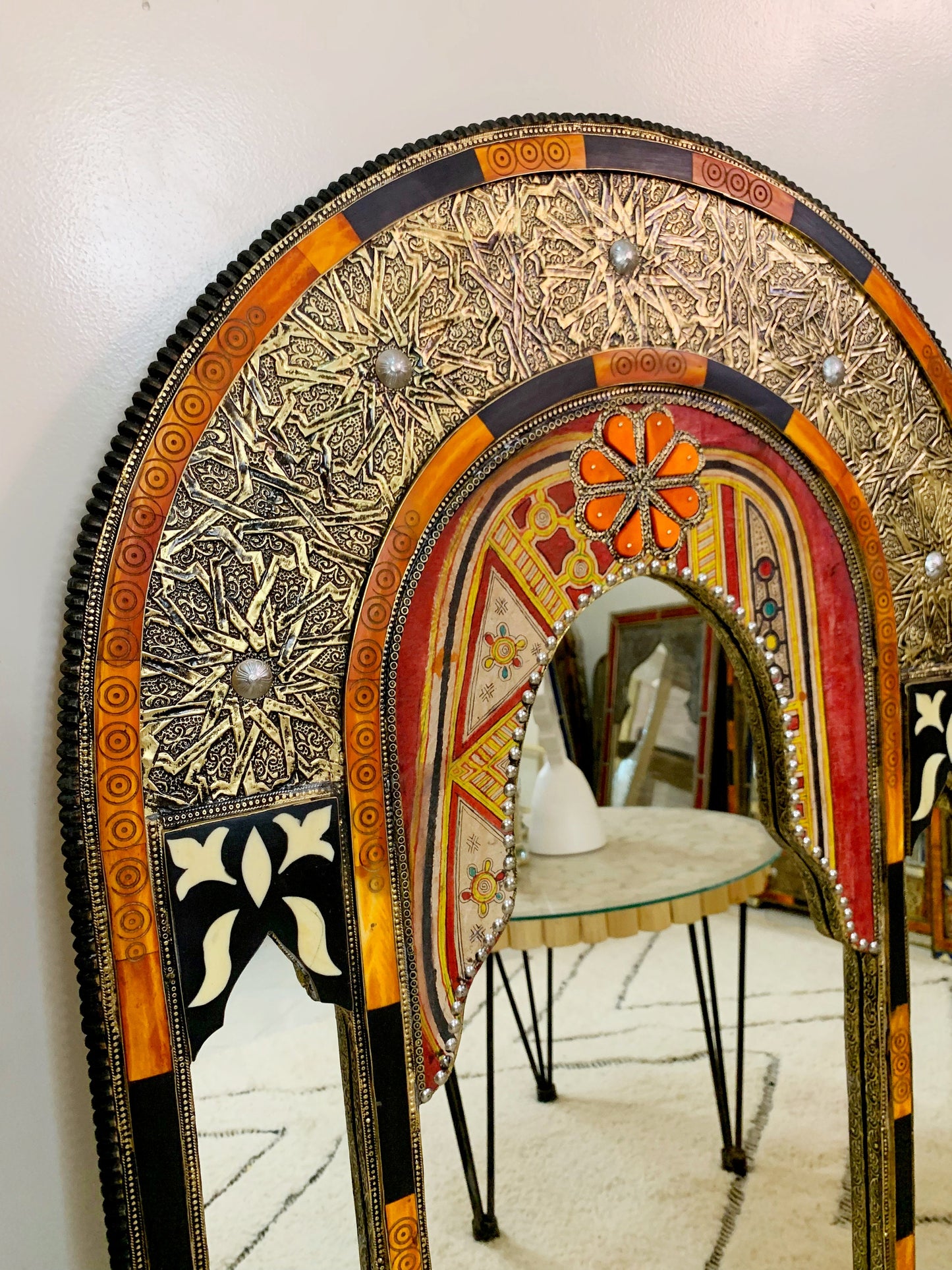 a mirror that is sitting on top of a table