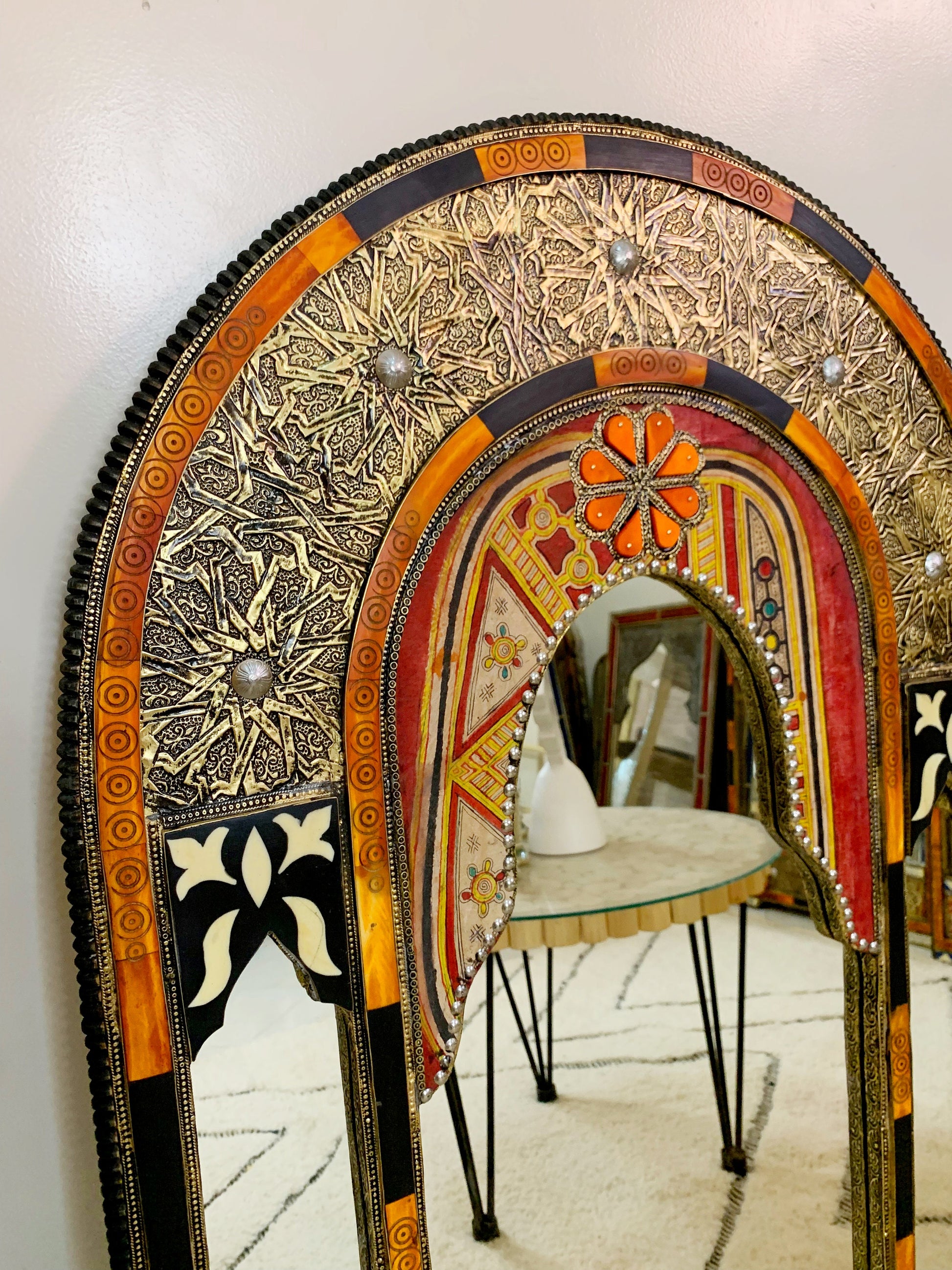 a mirror that is sitting on top of a table