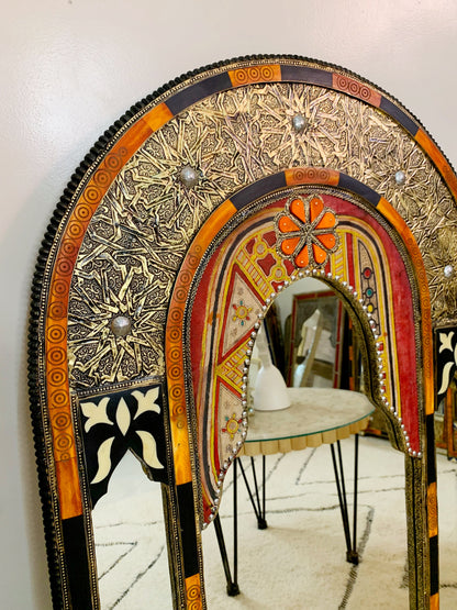 a mirror that is sitting on top of a table