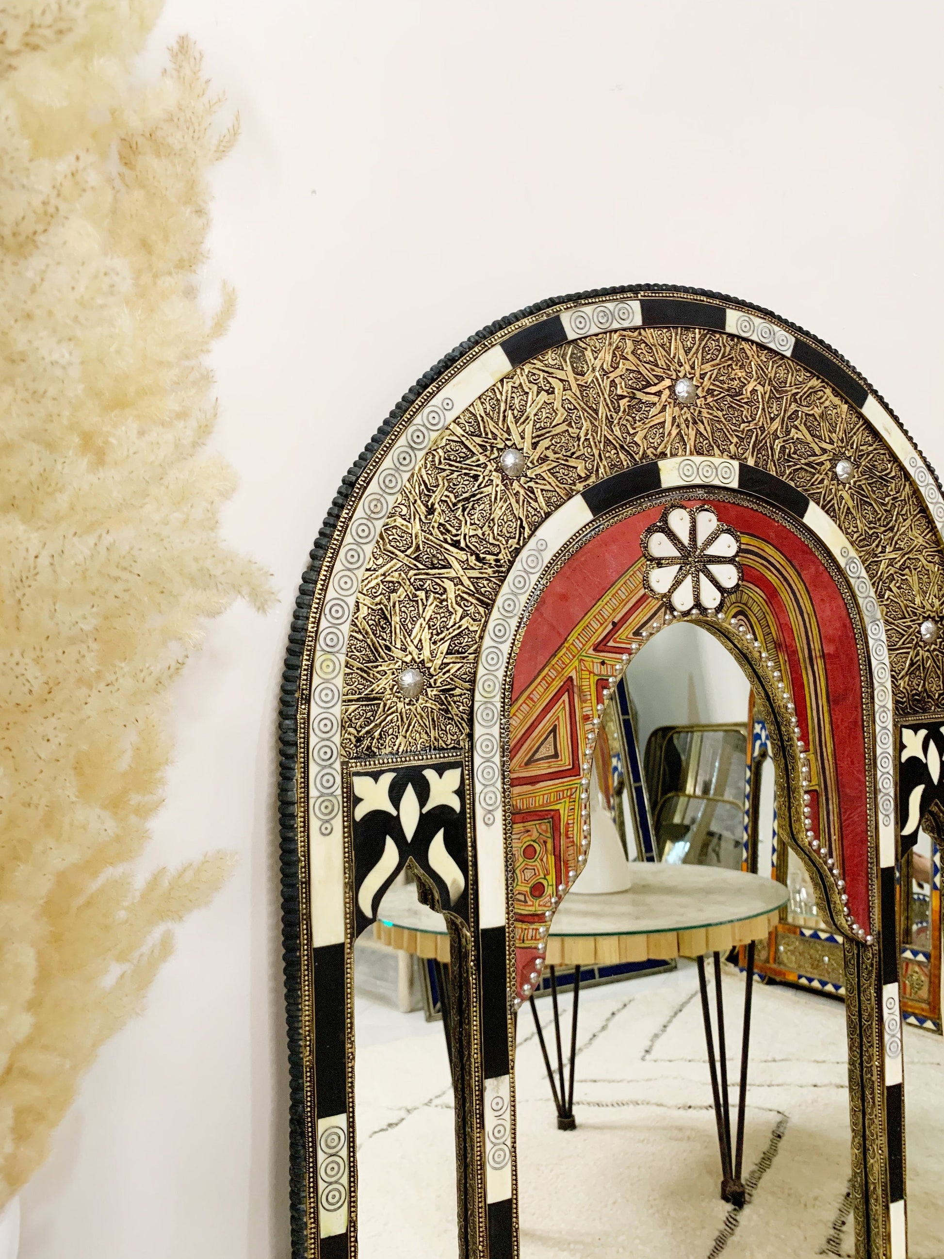 a mirror that has a chair in it