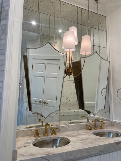 a bathroom with two sinks and a large mirror
