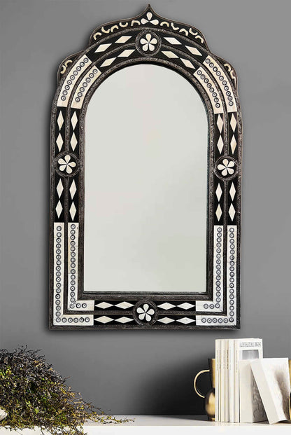 a mirror that is sitting on a table