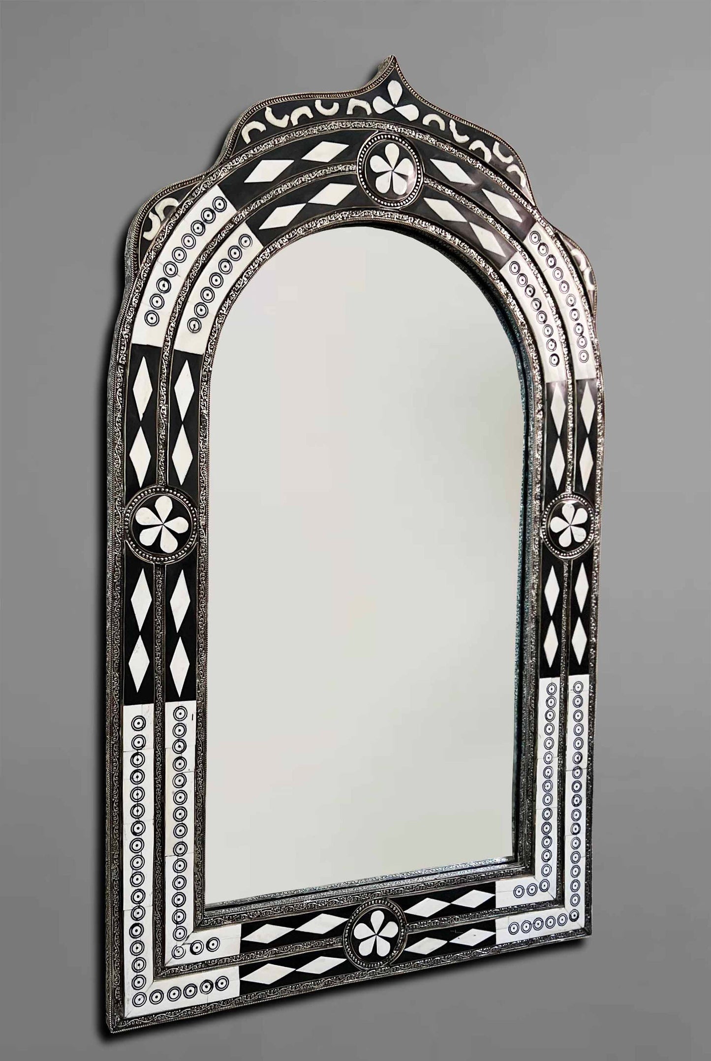 a mirror that is sitting on a wall
