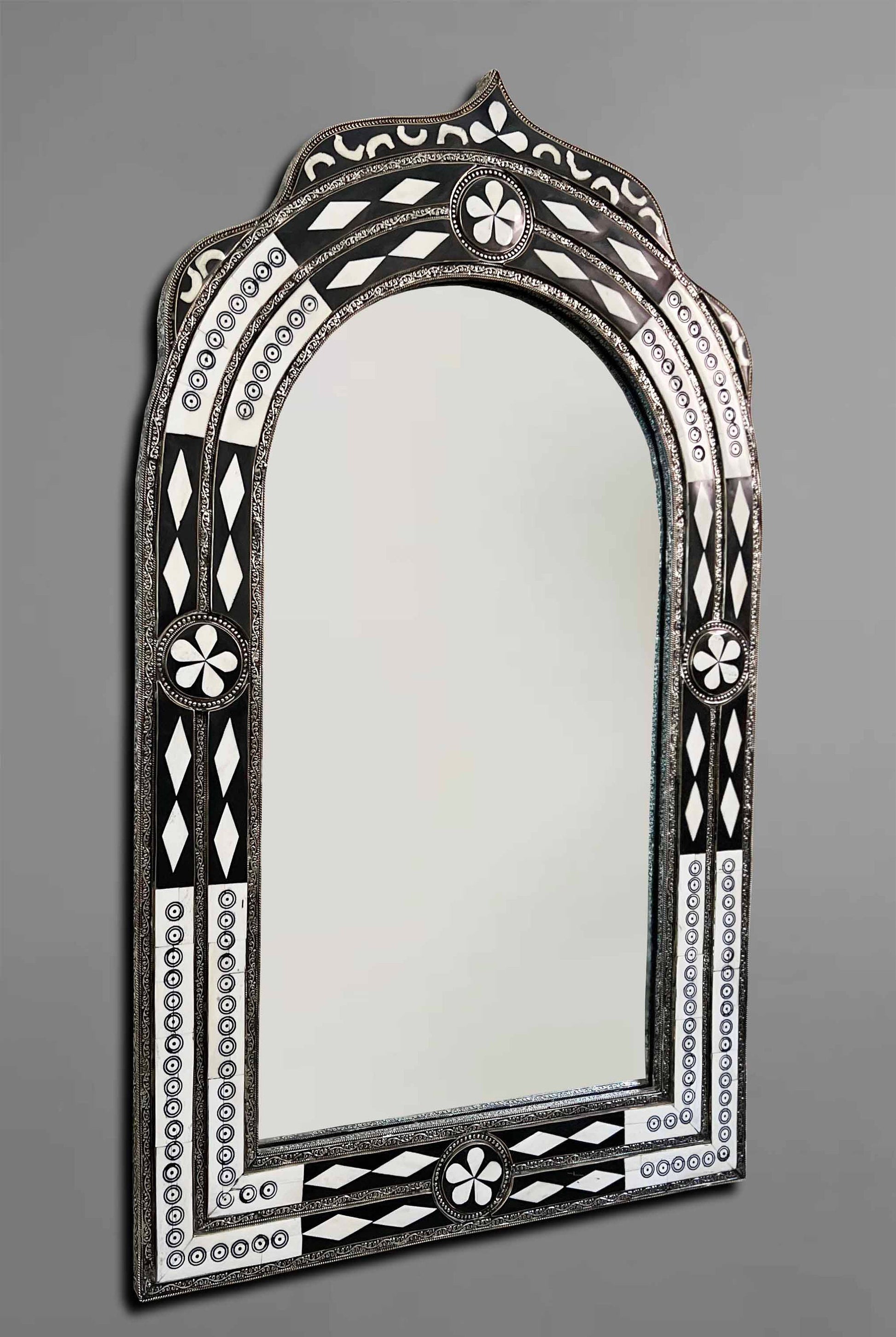 a mirror that is sitting on a wall