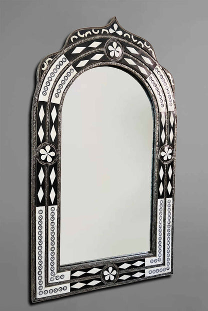 a mirror that is sitting on a wall
