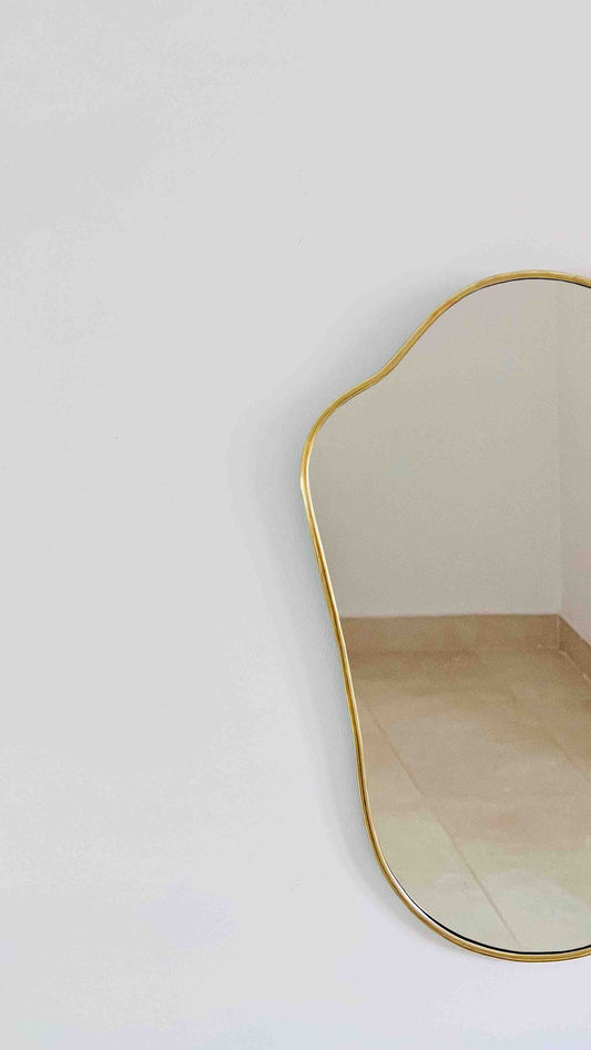 a mirror that is on the wall in a room