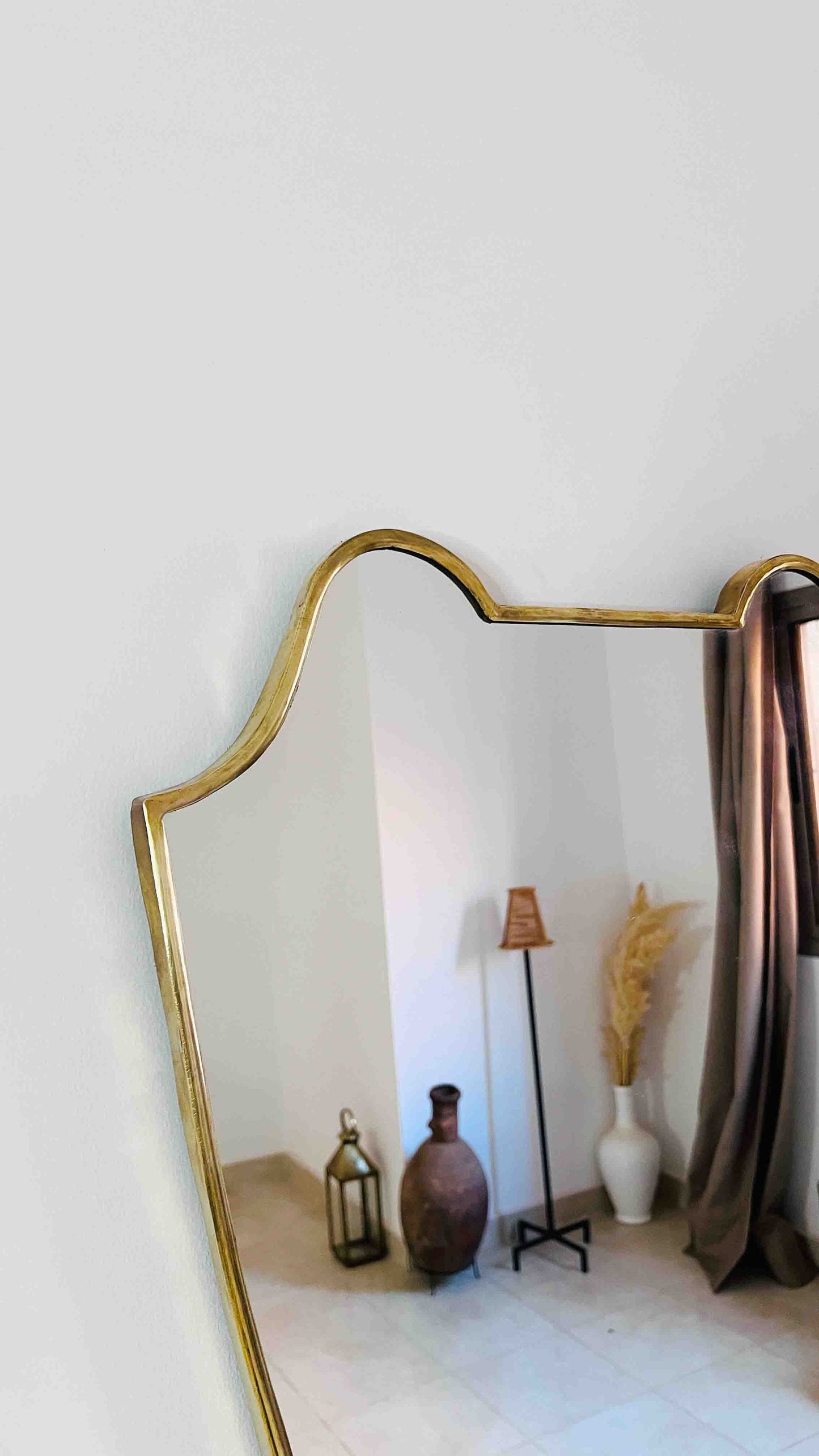 a mirror that is sitting on a wall