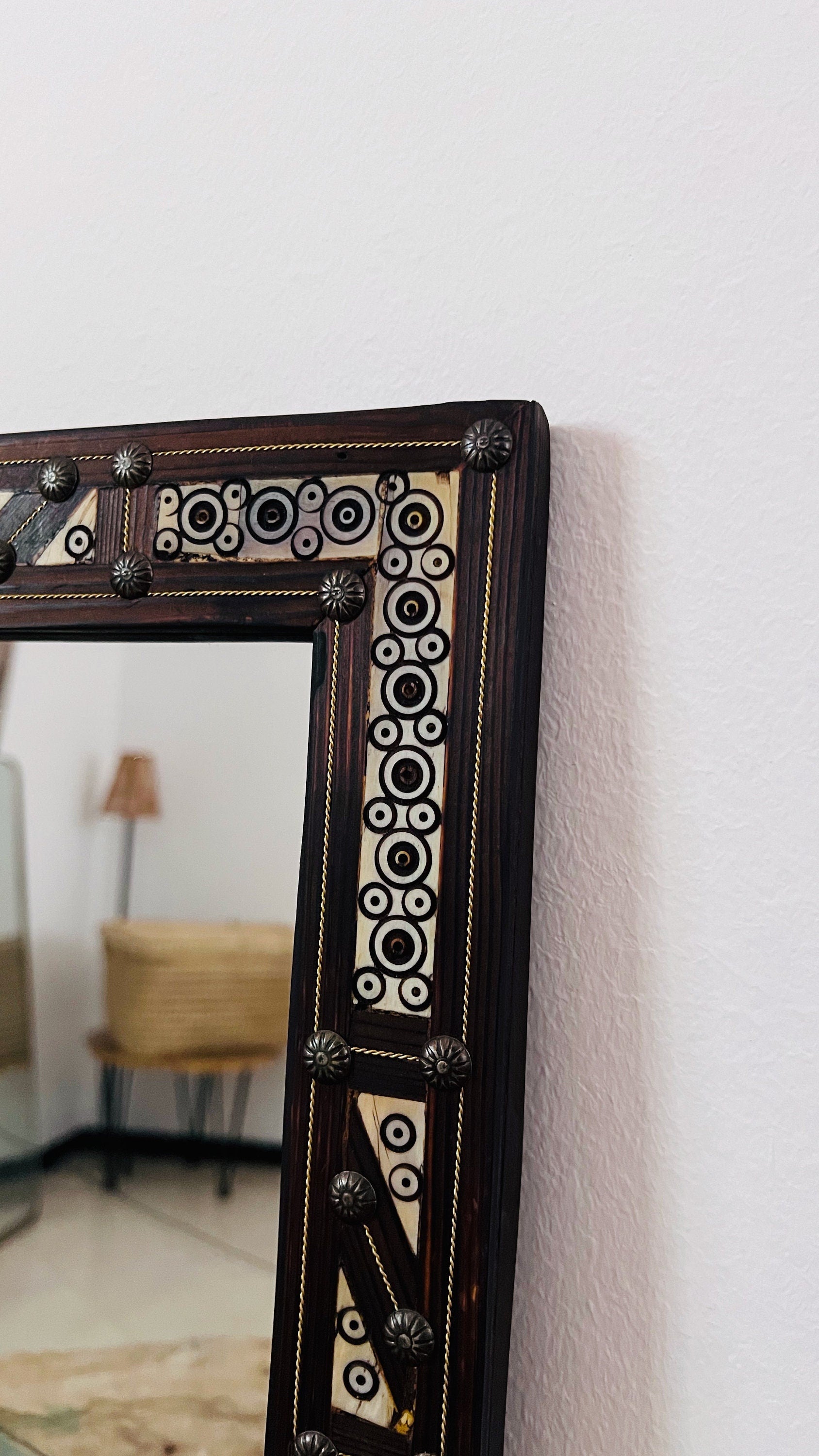 a mirror that is sitting on a wall